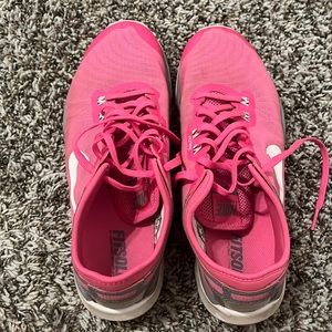 Bright pink Nike shoes